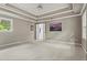 Spacious main bedroom with tray ceiling, neutral colors and carpeting at 1145 Cool Springs Nw Dr, Kennesaw, GA 30144