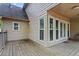 Covered porch featuring weathered planks and access to the backyard at 1145 Cool Springs Nw Dr, Kennesaw, GA 30144