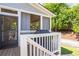 Cozy back porch with grilling station and screened-in section, perfect for entertaining or relaxing outdoors at 3042 Jefferson St, Atlanta, GA 30341