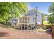 Beautiful backyard featuring a screened porch, playground, and lush greenery, perfect for outdoor enjoyment at 3042 Jefferson St, Atlanta, GA 30341