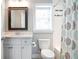 Bathroom with a single vanity, a toilet, and a bathtub with a shower curtain at 3042 Jefferson St, Atlanta, GA 30341