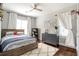bedroom featuring hardwood floors, ceiling fan, a basketball hoop, and playful decor at 3042 Jefferson St, Atlanta, GA 30341