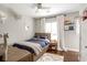 bedroom with a bed with built-in storage, hardwood floors, and playful dinosaur themed decor at 3042 Jefferson St, Atlanta, GA 30341