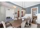 Spacious dining room with contemporary lighting and a view into other rooms at 3042 Jefferson St, Atlanta, GA 30341