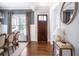 Dining area featuring hardwood floors, a statement mirror, and neutral decor at 3042 Jefferson St, Atlanta, GA 30341
