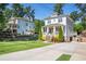 Inviting home featuring a covered front porch, mature trees, and a well-maintained lawn, enhancing its curb appeal at 3042 Jefferson St, Atlanta, GA 30341