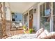 Inviting front porch featuring a swing, seating, and a decorative wreath on the wooden front door at 3042 Jefferson St, Atlanta, GA 30341