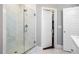 Frameless glass shower with marble tile, shower head, and a view to the walk-in closet at 3042 Jefferson St, Atlanta, GA 30341