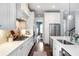 Bright kitchen with white cabinetry, stainless steel appliances, and hardwood floors at 3042 Jefferson St, Atlanta, GA 30341