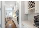 Modern kitchen with white cabinets, stainless steel appliances, and quartz countertops at 3042 Jefferson St, Atlanta, GA 30341