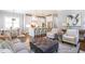 Open-concept living room and kitchen area featuring hardwood floors and a center island at 3042 Jefferson St, Atlanta, GA 30341