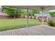 Spacious backyard with a well-manicured lawn, wooden fence and playhouse at 406 Mount Vernon Ct, Woodstock, GA 30189