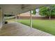 Covered deck overlooks the large grassy backyard with wood fence at 406 Mount Vernon Ct, Woodstock, GA 30189