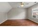 Bright bedroom showcasing hardwood floors, a window, and neutral-toned walls, offering functionality and comfort at 406 Mount Vernon Ct, Woodstock, GA 30189