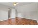 Bedroom featuring hardwood floors, offering practicality, and a view through an open door at 406 Mount Vernon Ct, Woodstock, GA 30189