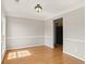Dining room with hardwood floors, light fixture, and natural light at 406 Mount Vernon Ct, Woodstock, GA 30189