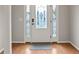 Inviting entryway features a beautifully designed front door and hardwood flooring at 406 Mount Vernon Ct, Woodstock, GA 30189