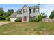 Traditional two-story home with a manicured lawn and charming curb appeal at 406 Mount Vernon Ct, Woodstock, GA 30189