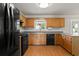 Kitchen featuring updated appliances and plenty of counter space at 406 Mount Vernon Ct, Woodstock, GA 30189