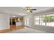 Spacious living room with kitchen, lots of natural light, and french doors at 406 Mount Vernon Ct, Woodstock, GA 30189