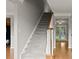 Classic staircase with carpeted steps and wood banister leading to the upper level at 406 Mount Vernon Ct, Woodstock, GA 30189