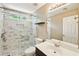 Bathroom with marble shower, vanity, and updated lighting at 1745 Fairburn Dr, Cumming, GA 30040