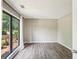 Serene bedroom with hardwood floors, natural light, and a calming ambiance, ideal for rest and relaxation at 1745 Fairburn Dr, Cumming, GA 30040