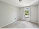 Bedroom with a large window and carpet at 1745 Fairburn Dr, Cumming, GA 30040