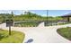 View of the community pond with a Veterans Memorial and walking path, offering a serene and reflective outdoor space at 1745 Fairburn Dr, Cumming, GA 30040