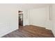 Dining room with wood floors, detailed trim and stainless steel refrigerator at 1745 Fairburn Dr, Cumming, GA 30040