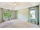 Spacious bedroom featuring large windows, carpet and ample natural light at 1745 Fairburn Dr, Cumming, GA 30040