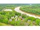 Aerial view showcasing homes backing up to the Chattahoochee River at 305 High Branch Way, Roswell, GA 30075