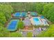 Birds-eye view of a neighborhood with tennis courts, a pool, and a central clubhouse at 305 High Branch Way, Roswell, GA 30075