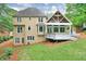 Beautiful backyard featuring a covered patio and landscaped garden for relaxed outdoor living at 305 High Branch Way, Roswell, GA 30075