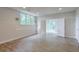 Basement with large window and walk out door; features neutral vinyl floors at 305 High Branch Way, Roswell, GA 30075