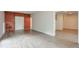 Large finished basement featuring built-in storage and vinyl floors at 305 High Branch Way, Roswell, GA 30075