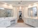Beautiful bathroom with double sink vanity, large mirrors, marble countertops and floors, and great lighting at 305 High Branch Way, Roswell, GA 30075