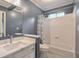 Cozy bathroom featuring a shower-tub combo, a single sink vanity, and a medicine cabinet at 305 High Branch Way, Roswell, GA 30075