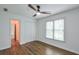 Clean and bright bedroom with hardwood floors, double closet and natural light from two windows at 305 High Branch Way, Roswell, GA 30075
