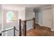 Elegant hallway with hardwood floors, chandelier, and staircase, creating a grand and inviting entrance at 305 High Branch Way, Roswell, GA 30075