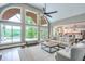 Spacious living room with vaulted ceilings, large windows, and a view of the water, offering a serene atmosphere at 305 High Branch Way, Roswell, GA 30075