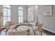 Comfortable sitting area with neutral furniture, large windows, and hardwood floors at 305 High Branch Way, Roswell, GA 30075