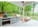 Covered patio with built-in grill area, providing an ideal outdoor cooking and entertaining space at 305 High Branch Way, Roswell, GA 30075