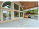 Charming outdoor patio with ceiling fan, gas grill, and picturesque backyard views at 305 High Branch Way, Roswell, GA 30075