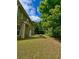 Large backyard with lawn, mature trees and patio at 4832 Batiste Nw Ln, Acworth, GA 30101