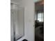A glass-enclosed shower in the bathroom with an adjoining bedroom at 4832 Batiste Nw Ln, Acworth, GA 30101
