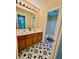 This bathroom features a double sink and decorative tile floor at 4832 Batiste Nw Ln, Acworth, GA 30101