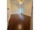 Well-lit bedroom with hardwood floors, ceiling fan, and a window providing natural light at 4832 Batiste Nw Ln, Acworth, GA 30101