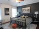 A stylish bedroom with dark accent wall, plush rug, and ample natural light offers a cozy retreat at 4832 Batiste Nw Ln, Acworth, GA 30101