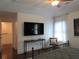 Bedroom features include a ceiling fan, sleek TV, and comforting natural light at 4832 Batiste Nw Ln, Acworth, GA 30101